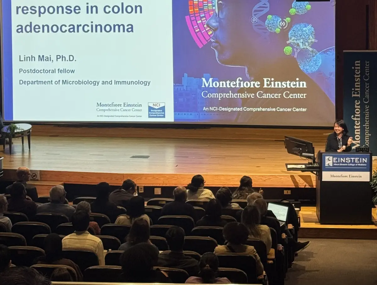 Dr. Linh Mai presenting in Robbins Auditorium at the 2026 MECCC Annual Scientific Retreat